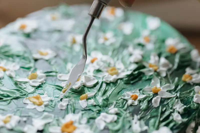 Close-up of a beautifully decorated floral cake with detailed icing work, perfect for occasions